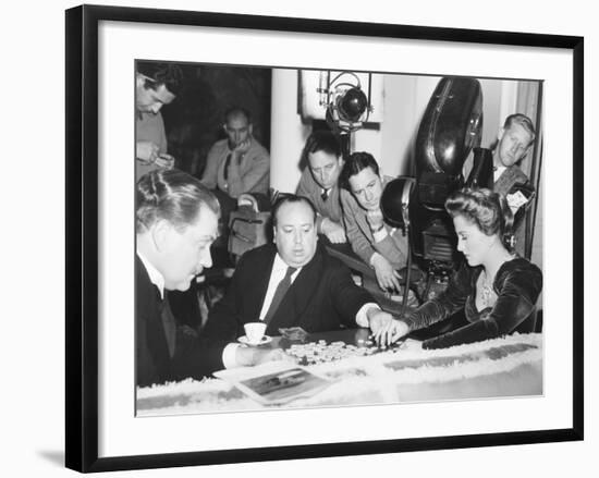 Director Hitchcock Directing a Scrabble Scene with Joan Fontaine in Suspicion-null-Framed Photo