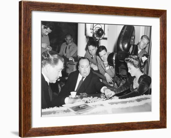 Director Hitchcock Directing a Scrabble Scene with Joan Fontaine in Suspicion-null-Framed Photo