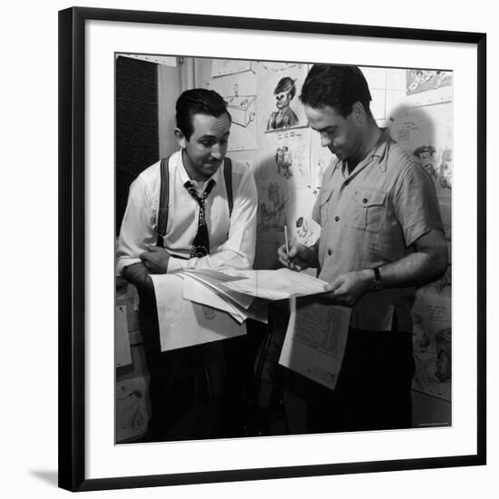 Director Walt Disney Looking over Sketches from His Latest Picture "Pinocchio."-Peter Stackpole-Framed Premium Photographic Print