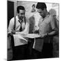 Director Walt Disney Looking over Sketches from His Latest Picture "Pinocchio."-Peter Stackpole-Mounted Premium Photographic Print