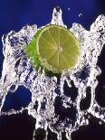 Slice of Lime on Splashing Water-Dirk Olaf Wexel-Photographic Print