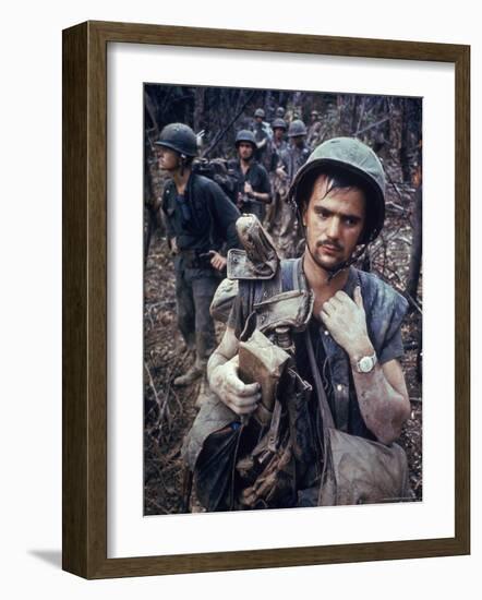 Dirty, Exhausted Looking US Marine on Patrol with His Squad Near the DMZ During the Vietnam War-Larry Burrows-Framed Premium Photographic Print