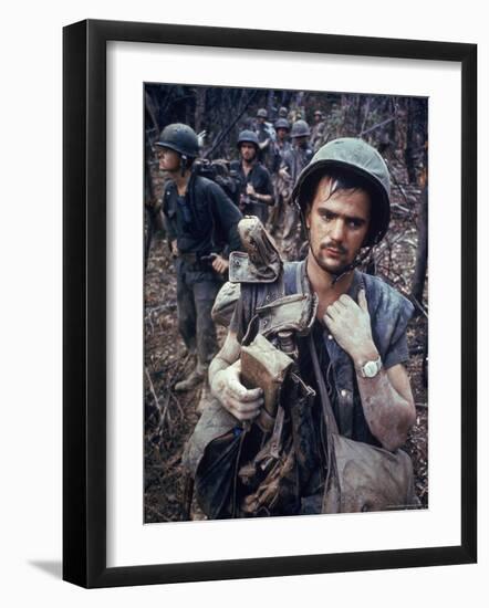 Dirty, Exhausted Looking US Marine on Patrol with His Squad Near the DMZ During the Vietnam War-Larry Burrows-Framed Premium Photographic Print