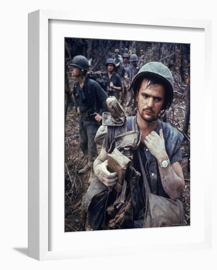 Dirty, Exhausted Looking US Marine on Patrol with His Squad Near the DMZ During the Vietnam War-Larry Burrows-Framed Premium Photographic Print