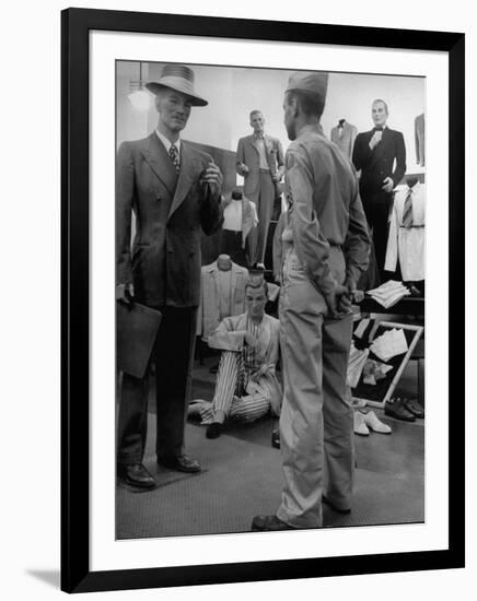 Discharged Gi Looking at New Suit Fashions-Nina Leen-Framed Photographic Print