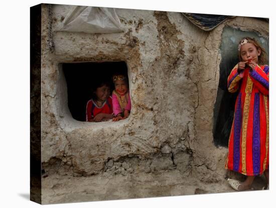 Displaced Girls Smile as They Look Out from a Shanty, in a Refugee Camp in Kabul, Afghanistan-null-Stretched Canvas