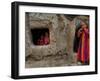 Displaced Girls Smile as They Look Out from a Shanty, in a Refugee Camp in Kabul, Afghanistan-null-Framed Photographic Print