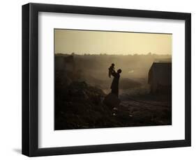 Displaced Man Holds His Baby Next to His Tent in Jalozai Refugee Camp Near Peshawar, Pakistan-null-Framed Photographic Print