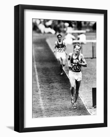Distance Champion Emil Zatopek as He Set a New 10,000 Meter Record During the Olympic Games-Frank Scherschel-Framed Premium Photographic Print
