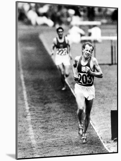 Distance Champion Emil Zatopek as He Set a New 10,000 Meter Record During the Olympic Games-Frank Scherschel-Mounted Premium Photographic Print