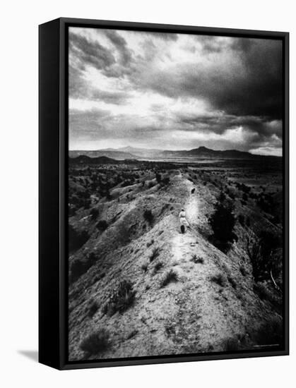 Distant of Artist Georgia O'Keeffe Taking Her Evening Walk at Ghost Ranch-John Loengard-Framed Stretched Canvas