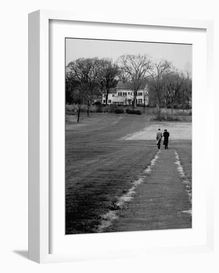 Distant of Mathematicians Albert Einstein and Kurt Godel Taking a Walk-Leonard Mccombe-Framed Premium Photographic Print