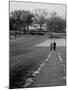 Distant of Mathematicians Albert Einstein and Kurt Godel Taking a Walk-Leonard Mccombe-Mounted Premium Photographic Print