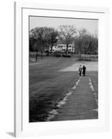 Distant of Mathematicians Albert Einstein and Kurt Godel Taking a Walk-Leonard Mccombe-Framed Premium Photographic Print