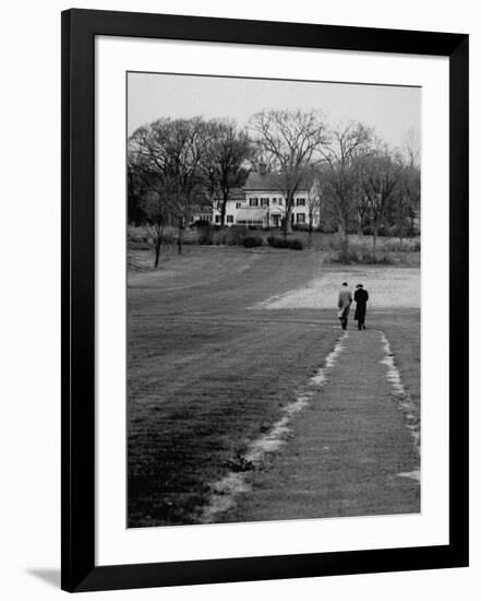 Distant of Mathematicians Albert Einstein and Kurt Godel Taking a Walk-Leonard Mccombe-Framed Premium Photographic Print