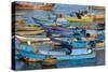 Distinctive red and blue fishing fleet in major fishing port of Nha Trang, South Central Vietnam.-Tom Haseltine-Stretched Canvas