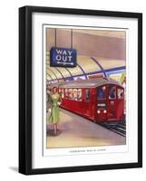 District Line Train in the Standard Red Colour on Its Way to Morden Southwest London-null-Framed Art Print