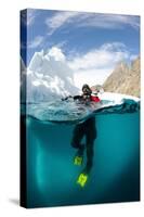 Diver in Front of an Iceberg, Astrolabe Island, Antarctic Peninsula, Antarctica-null-Stretched Canvas