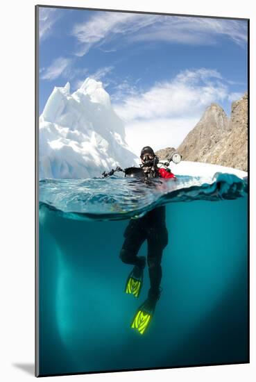 Diver in Front of an Iceberg, Astrolabe Island, Antarctic Peninsula, Antarctica-null-Mounted Photographic Print