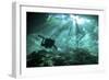 Diver Passes Through Light Beams in Chac Mool Cenote in Mexico-null-Framed Photographic Print