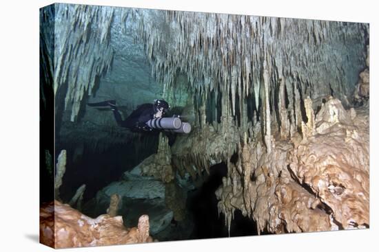 Diver Using Side Mount Gear in Cave in Mexico-null-Stretched Canvas