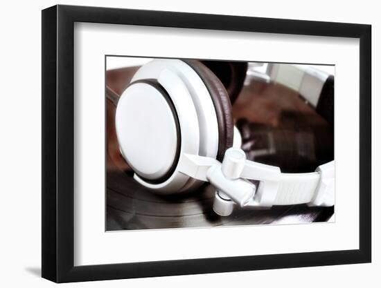 Dj Headphones Lying over Old Vinyl-fotosutra.com-Framed Photographic Print