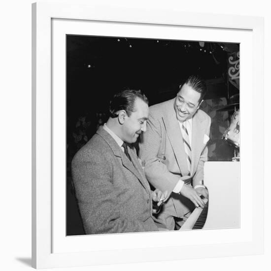 Django Reinhardt at the Aquarium in New York City, 1946-William Paul Gottlieb-Framed Photographic Print