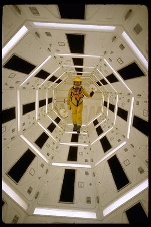 Distance Shot of Actor in Astronaut Suit Walking Through Geometrically Designed Hal Computer Center