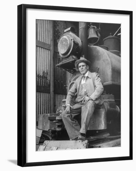 "Doby Doc" Sitting in Front of One of the First "Iron Horses" in the West-null-Framed Photographic Print