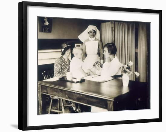 Doctor Examines a Baby at a Dispensary-null-Framed Photographic Print