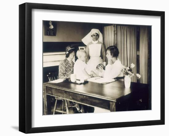 Doctor Examines a Baby at a Dispensary-null-Framed Photographic Print