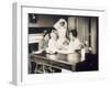 Doctor Examines a Baby at a Dispensary-null-Framed Photographic Print