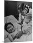 Doctor Examining Giggling Patient Recovering from Cold-Hansel Mieth-Mounted Photographic Print