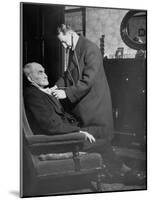 Doctor Making a House Call to an Ill Elderly Man, Listening to the Rhythm of His Heart-null-Mounted Photographic Print