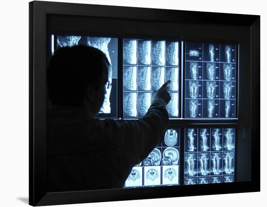 Doctor Pointing to X-Ray Images on Computer Screen-null-Framed Photographic Print