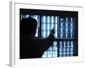 Doctor Pointing to X-Ray Images on Computer Screen-null-Framed Photographic Print