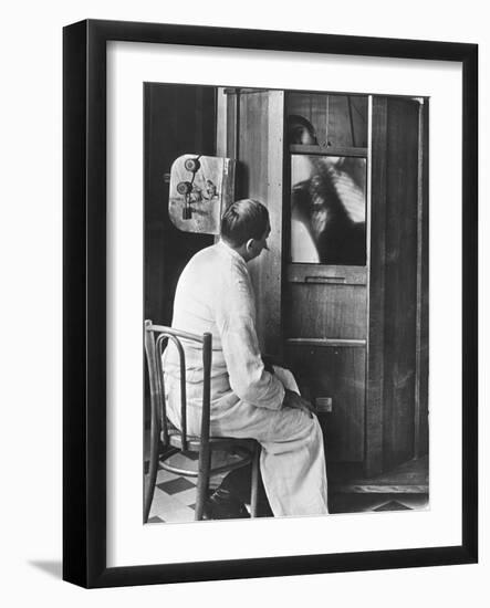 Doctor Using a Fluoroscope-null-Framed Photographic Print