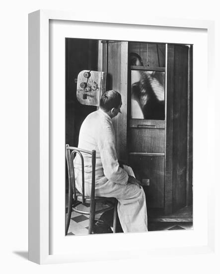 Doctor Using a Fluoroscope-null-Framed Photographic Print