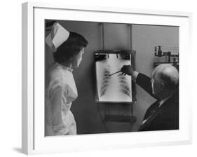 Doctors Examining X-Ray with Nurse-null-Framed Photographic Print