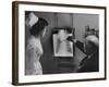 Doctors Examining X-Ray with Nurse-null-Framed Photographic Print