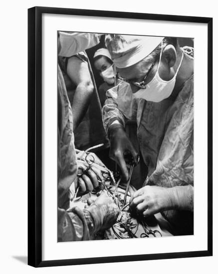 Doctors Performing a Perfusion Operation for Treatment of Cancer-null-Framed Photographic Print