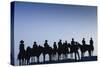 Dodge City Sign with Cowboy Silhouettes, Kansas, USA-Walter Bibikow-Stretched Canvas