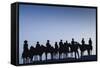 Dodge City Sign with Cowboy Silhouettes, Kansas, USA-Walter Bibikow-Framed Stretched Canvas