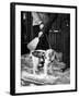 Dog Gets Snow Brushed from His Coat by Hotel Doorman-Alfred Eisenstaedt-Framed Photographic Print