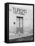 Dog Guarding a Tourist Office-Jerry Cooke-Framed Stretched Canvas