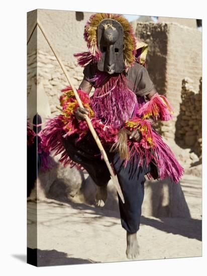 Dogon Country, Tereli, A Masked Dancer Leaps High in the Air at the Dogon Village of Tereli, Mali-Nigel Pavitt-Stretched Canvas