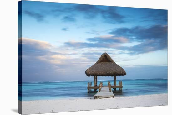 Dominican Republic, Punta Cana, Playa Blanca, Wooden Pier with Thatched Hut-Jane Sweeney-Stretched Canvas