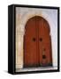 Door in Brown Arch-Perry Mastrovito-Framed Stretched Canvas