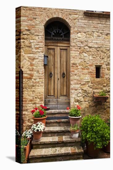 Doorway with Flowers, Pienza, Tuscany, Italy-Terry Eggers-Stretched Canvas