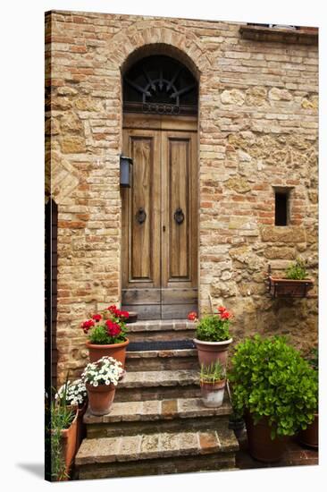 Doorway with Flowers, Pienza, Tuscany, Italy-Terry Eggers-Stretched Canvas